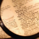 Magnifying Glass over Dictionary